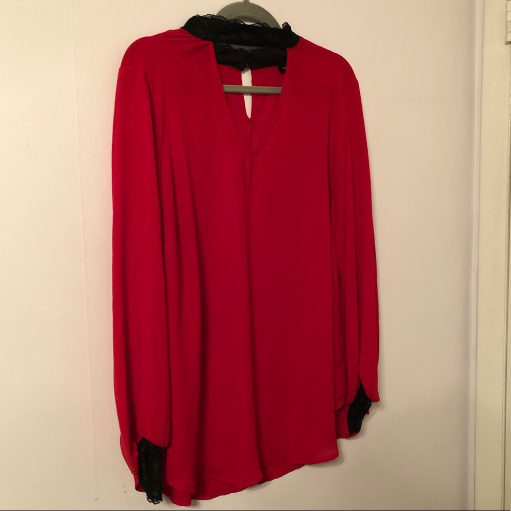 Torrid long sleeve top with lace detail.